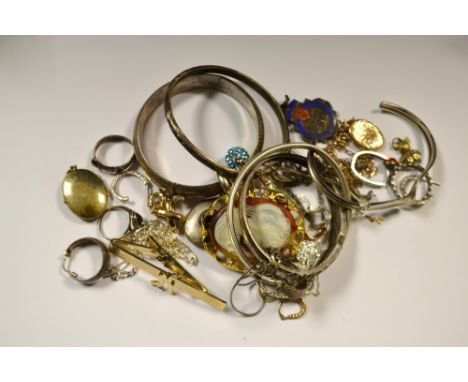 A silver bangle, marked 925, another similar, others;  an advanced silver swimming medal, Birmingham 1937;  a silver ring as 