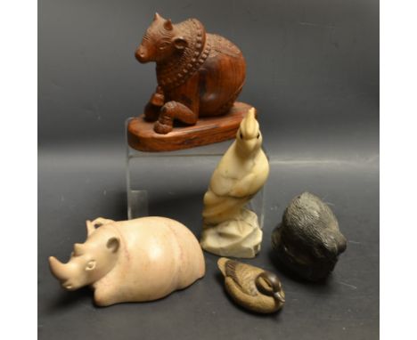 A soapstone hippopotamus;  Poole Pottery duck;  a treen cow with bell etc (5)