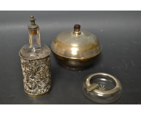 An Art Deco silver powder bowl and cover, engine turned, Birmingham hallmark; an Edwardian scent bottle, pierced silver mount