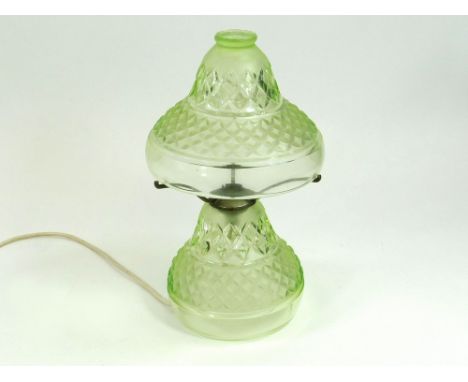 GLASS TABLE LAMP. A mid-20th century, moulded, green glass table lamp with chromed fitting. Full height 36cm. For safety, all