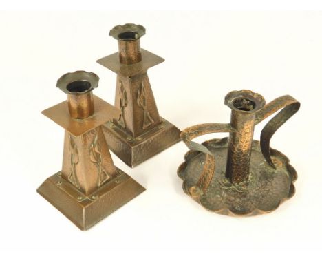 HAYLE COPPER. A pair of Hayle copper candlesticks, height 15cm. Also, a Hayle copper, twin-handled chamber stick, diameter 13