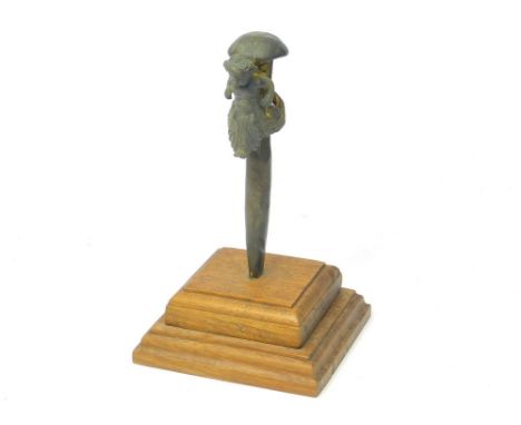 BRONZE MER-BABY. A cast bronze Mer-baby mounted on a ship's copper fastening spike, recovered from the wreck of H.M.S. Anson,