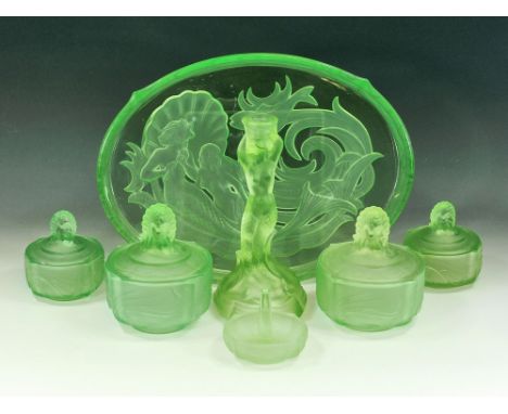 WALTHER & SOHNE. An Art Deco Walther & Sohne green moulded glass dressing table set with tray, candlestick, powder bowls, rin