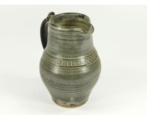 LEACH POTTERY. A two-pint pitcher with the Cornish motto 'One And All', Leach Pottery mark. Height 20cm. (Firing mark & other