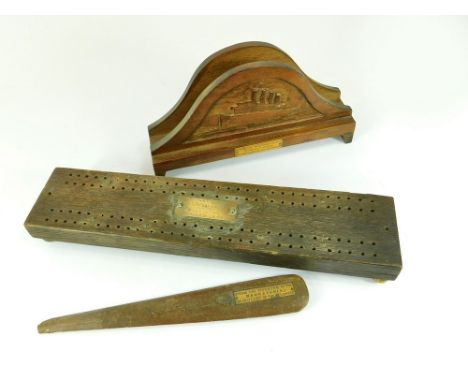 NAVAL SOUVENIRS. A souvenir letter rack made from decking of the Mauritania, width 21.5cm. Also, a timber cribbage board from