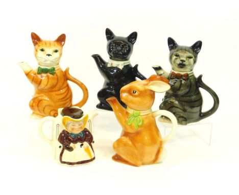 WOODS OF BURSLEM ETC. Three Woods of Burslem Pussy Foot cat teapots, with leaflets. Also, a Woods of Burslem Rabbit teapot & 