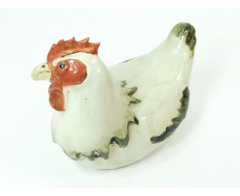 LYNN DAVEY. A unique stoneware sculpture of a rare breed, Light Sussex sitting hen. Initialled LD to the base. Length 22cm, h