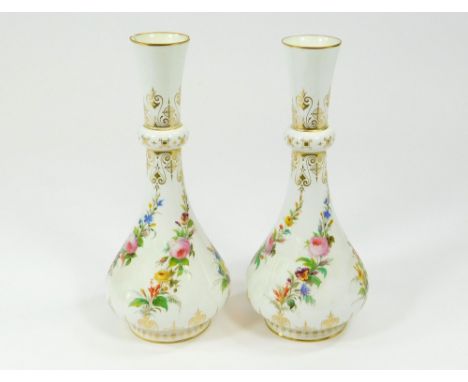 SEVRES. A pair of mid 19th century Sevres hand painted & gilded vases. R F. S.71 mark. Height 22.5cm. (One with hairline crac