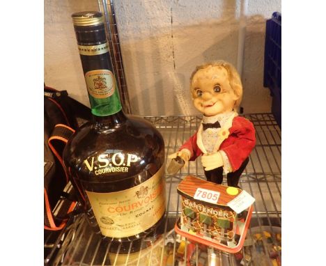 Vintage battery powered mechanical bartender and an ice bucket in the form of Courvoisier Cognac bottle
