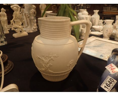 Ceramic jug with applied decoration by Turners c1805 H: 25 cm CONDITION REPORT: Firing cracks to the neck