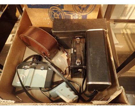 Box of mixed cine cameras and a projector
