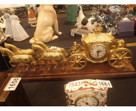 Horse and carriage clock mounted on a walnut base L: 45 cm