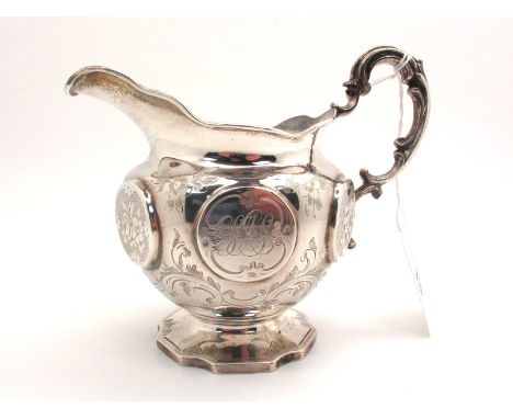 A Decorative Hallmarked Silver Jug, RP, London 1853, with circular panel detail, floral engraved and initialled, gilt lined, 