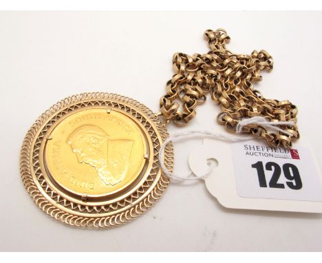 A Krugerrand, 1980, loose set within wide openwork pendant mount, stamped "375", suspended on an oval belcher link chain stam