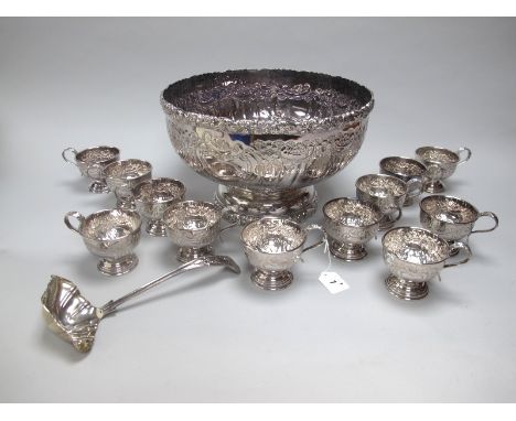 A Highly Decorative Mappin &amp; Webb Plated Punch Bowl, allover chased decoration of flowerheads and leaf scrolls, on raised