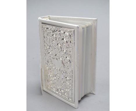 A Modern Hallmarked Silver Mounted Copy of The Bible, (containing Old and New Testaments) the rectangular panel allover detai