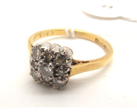 A Diamond Set Square Cluster Ring, claw set throughout with brilliant and single cut stones, stamped "18ct Plat" (finger size
