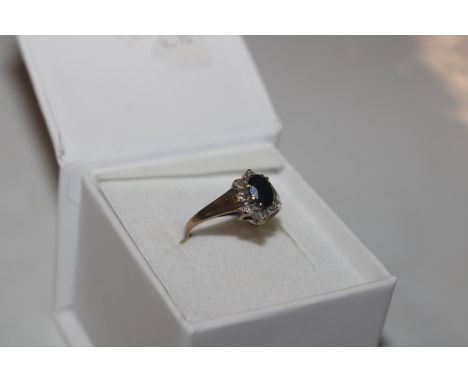 A 9ct gold sapphire and diamond set ring, size L/M