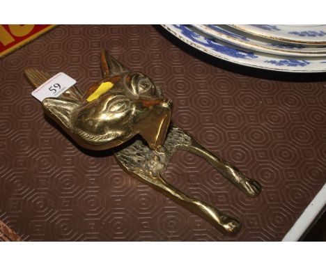 A brass fix head door knocker 