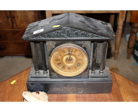 A slate two hole mantel clock 