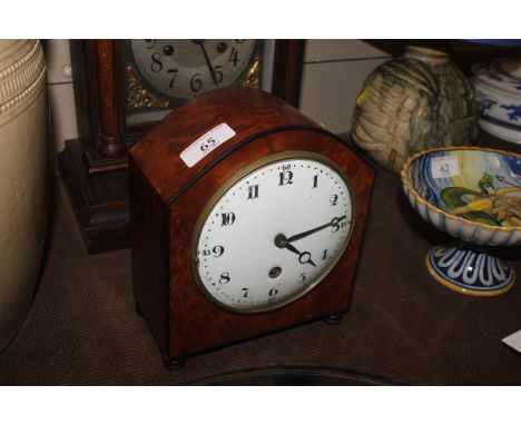 A walnut cased mantel clock 