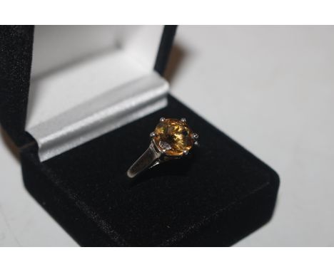 A 925 silver ring set with citrine coloured stone 