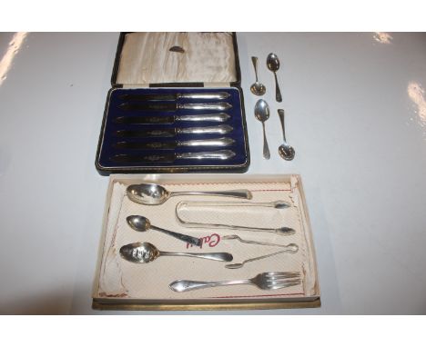 A collection of silver spoons, silver fork, two pairs of silver sugar tongs, approx. total weight 172gms; and a cased set of 