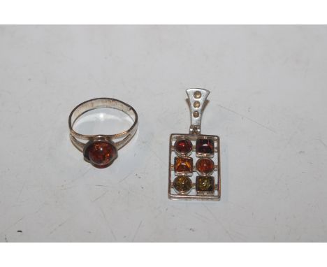 A Sterling silver and amber ring and similar pendant 
