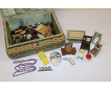 A sewing basket and contents of dolls house furniture, button etc.