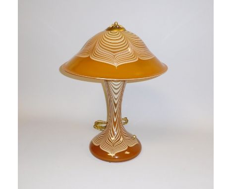 Stuart Abelman, 3-light art glass table lamp. Amber glass base and shade with cream pulled feather design, with additional ba