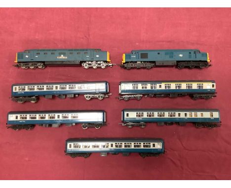 Two 00 gauge BR Blue Diesel locomotives by Hornby and Lima, together with five coaches in Blue Grey, untested