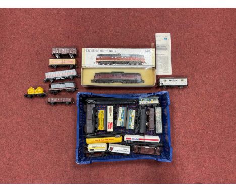 A boxed Piko HO scale BR130 German Diesel locomotive together with approximately twenty wagons by Lima and others, all playwo