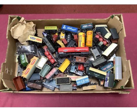 Approximately fifty 00 gauge wagons by Hornby, Lima, Mainline and others, playworn.