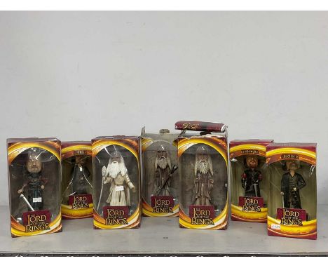 Seven Upper Deck Entertainment The Lord Of The Rings Bobble Head Figurines. Damages/faults noted to both figurines and boxes.