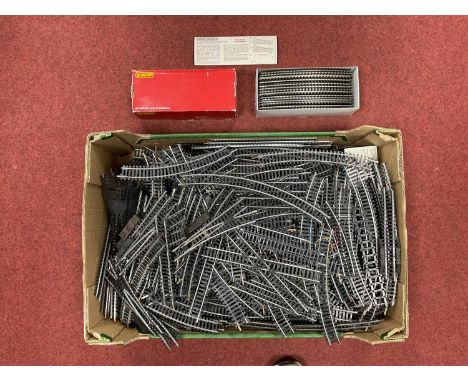 A large quantity of used 00 gauge steel track by Hornby and Lima and including approximately twenty points and diamonds.