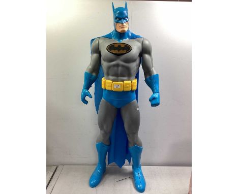 A Jakks Pacific DC Comics Batman Plastic Figure, standing four feet tall, some damage/split to light blue boot.