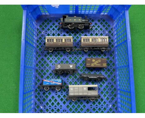 An unboxed Hornby Great Western 0-4-0 tank engine, untested, together with two Hornby four-wheel coaches, three goods wagons 