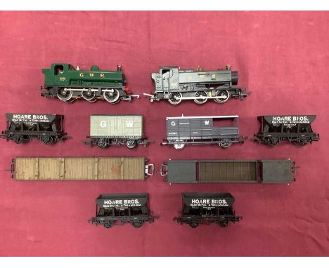 Two 00 gauge GWR Pannier tank engines by Lima and Hornby together with seven goods wagons by Mainline and others and a Hornby