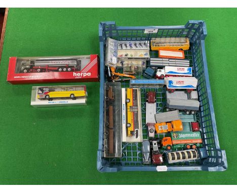 Approximately seventeen HO scale commercial vehicles with a Continental theme together with four packs of HO figures.