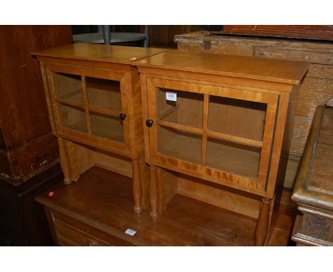 A pair of circa 1900 satinwood glazed compartments in the Biedermeier taste (formerly upper sections of larger item of furnit