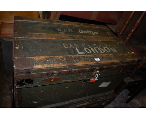 An early 20th century stained pine and metal bound hinge top military travelling trunk, having iron end carry handles, width 