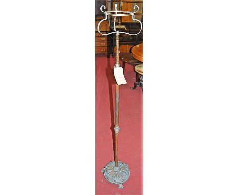 An Art Nouveau copper and brass paraffin lamp stand, with telescopic action (lacking burner)