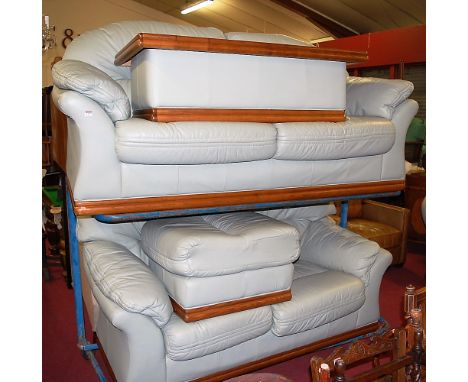 A contemporary mint green leather upholstered lounge suite comprising; three-seater sofa, two-seater sofa, single armchair, l