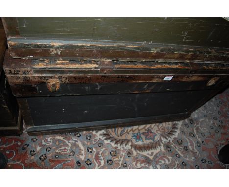 An early 20th century stained pine and metal bound hinge top military travelling trunk, having iron end carry handles, width 
