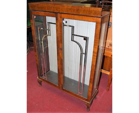 An Art Deco figured walnut double door glazed china display cabinet on squat cabriole supports, width 89.5cm