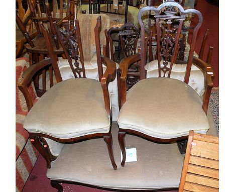 An Edwardian mahogany parlour suite comprising; two seater button back sofa, pair of elbow chairs, and four side chairs (with