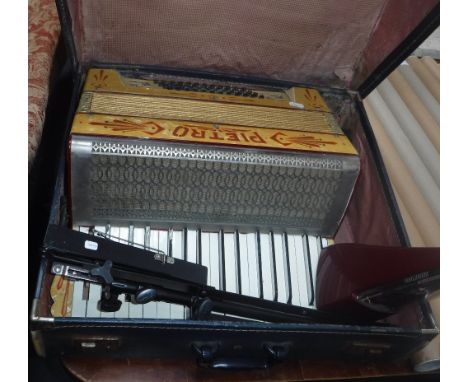 A 48 BASS PIETRO ACCORDIAN IN CASE, a metronome and a music stand (3)