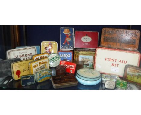 A VINTAGE FIRST-AID TIN with contents and other various tins