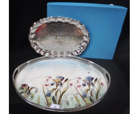 A SILVER PLATED TRAY in a cardboard box and an Edwardian oval plated tray with ceramic base decorated with Iris