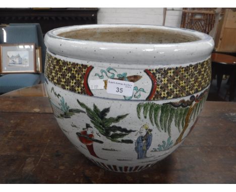 A CHINESE CERAMIC JARDINIERE with polychrome painted figures in landscape decoration, 11.5" high x 14" dia